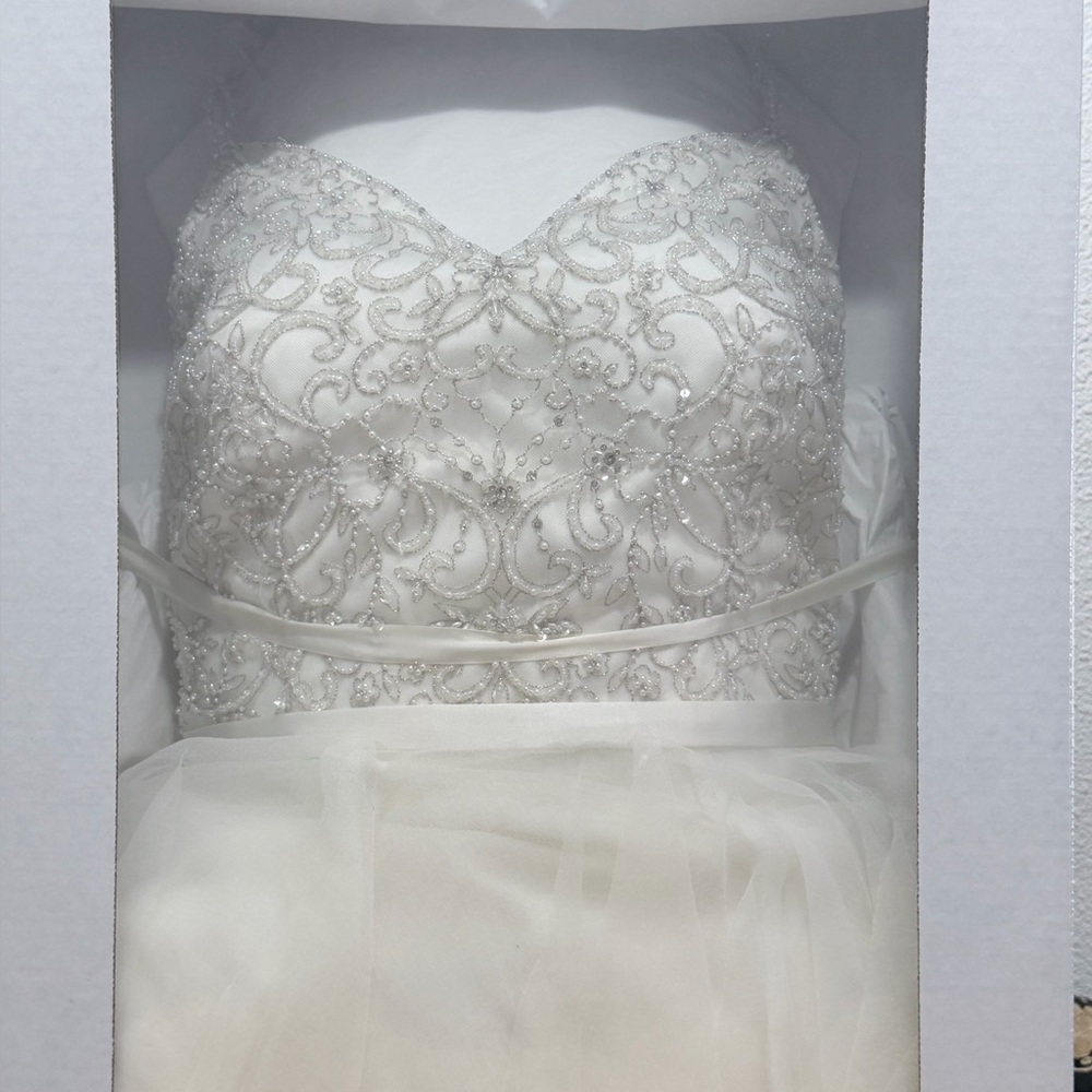 Elegant White Beaded wedding dress. Purchased from David’s Bridal.